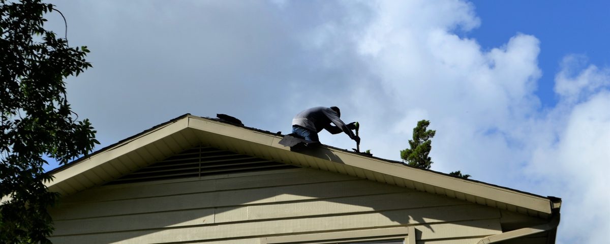 roofing contractor on a roof