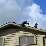 roofing contractor on a roof